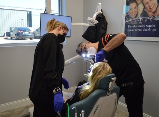 person in dental chair getting dental work done